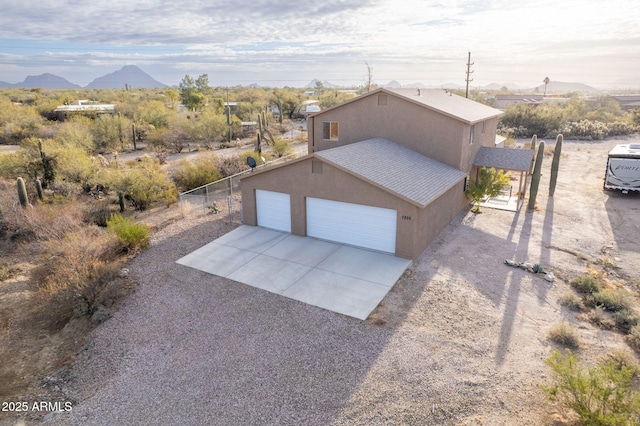 exterior space featuring a mountain view and a garage