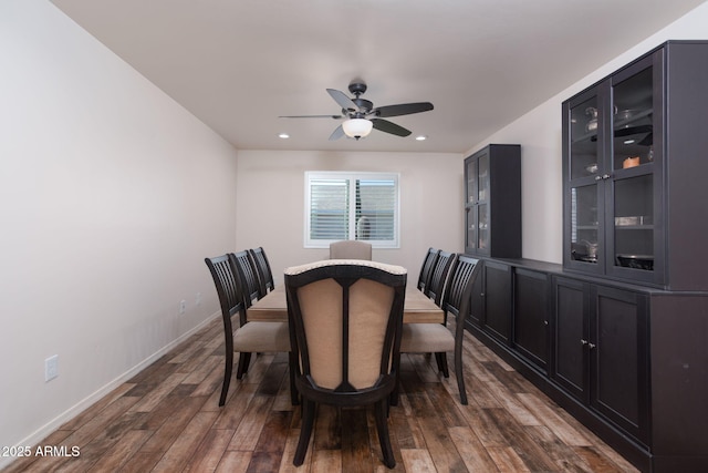 dining area featuring ceiling fan and dark hardwood / wood-style flooring