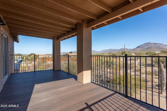 wooden terrace featuring a mountain view