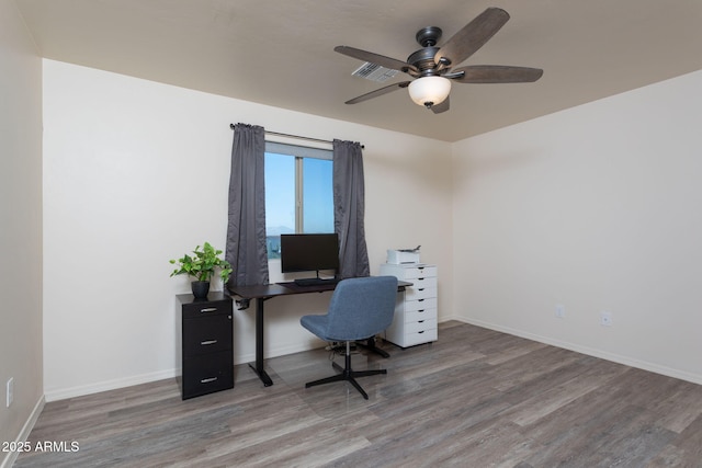 office area with ceiling fan and hardwood / wood-style floors