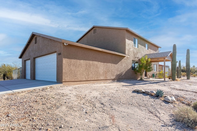 view of property exterior with a garage