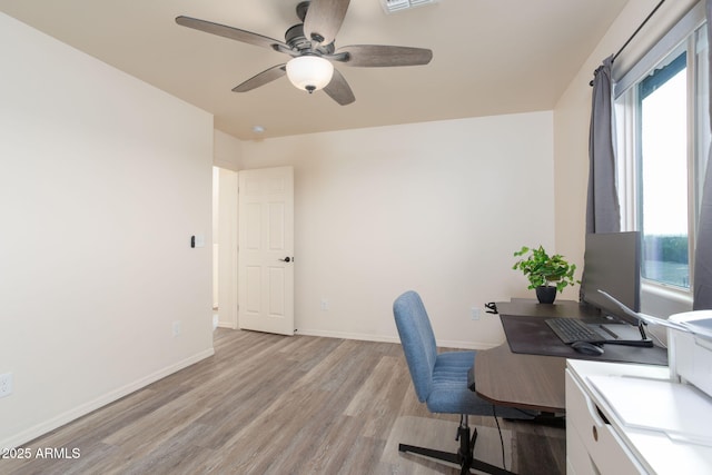 office space with light wood-type flooring and ceiling fan