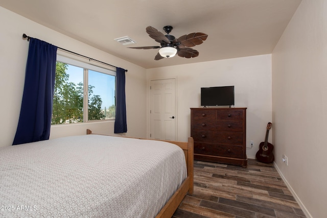 bedroom featuring ceiling fan and dark hardwood / wood-style floors