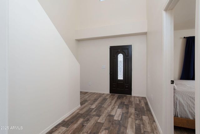 entryway with dark wood-type flooring