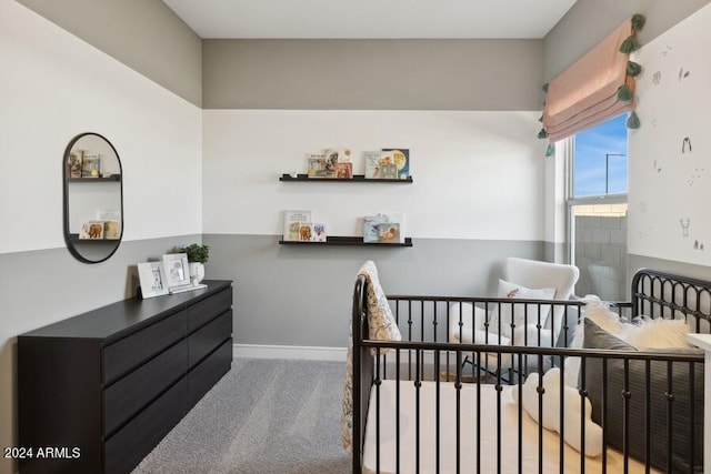 bedroom featuring carpet flooring and a crib