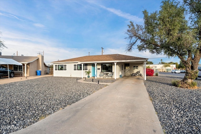 single story home featuring a carport