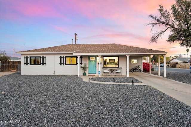 view of front facade with a carport