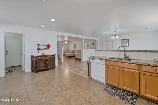 kitchen with decorative light fixtures, open floor plan, a sink, dishwasher, and ceiling fan with notable chandelier