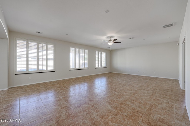 tiled empty room with ceiling fan