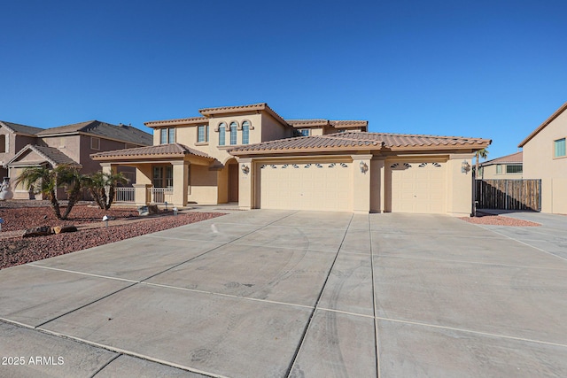 mediterranean / spanish house with a garage