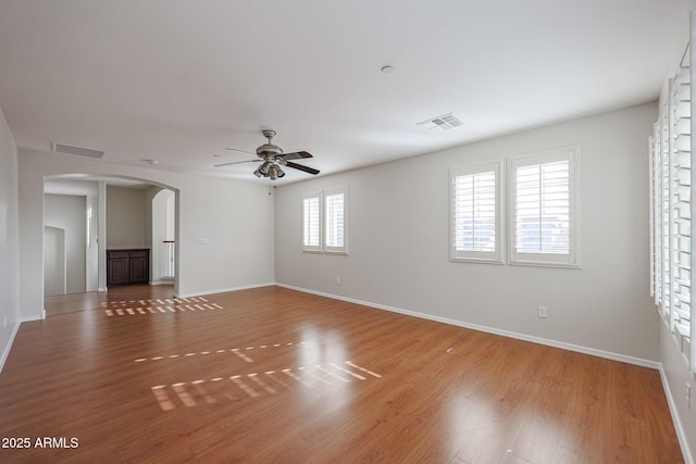 unfurnished room featuring ceiling fan and wood-type flooring