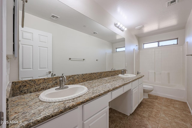 full bathroom with vanity, shower / bath combination, and toilet