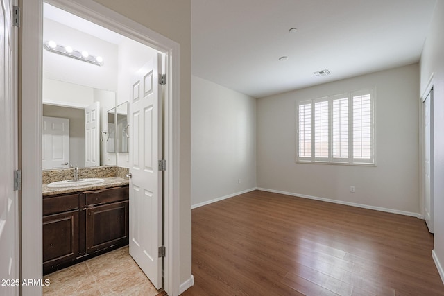 bathroom featuring vanity and hardwood / wood-style flooring