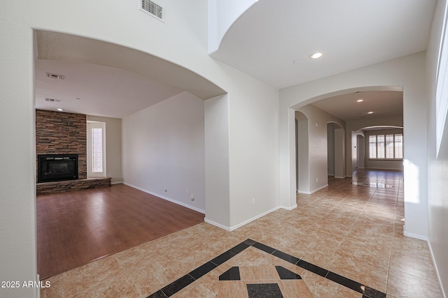 unfurnished living room featuring a fireplace