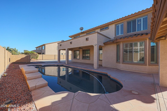 view of pool featuring ceiling fan and a patio area