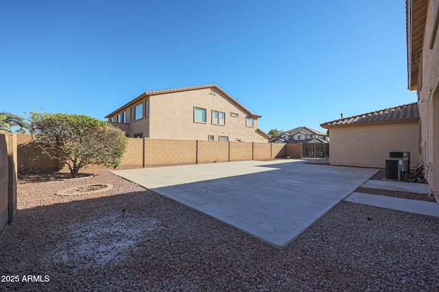 view of yard featuring cooling unit and a patio area