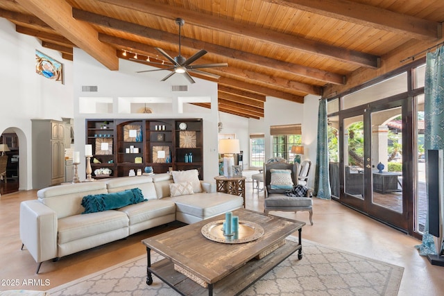 5540 E Mercer Ln, Scottsdale, AZ 85254 - living area featuring a wooden ceiling with exposed beams, a ceiling fan, high vaulted ceiling, arched walkways, and french doors