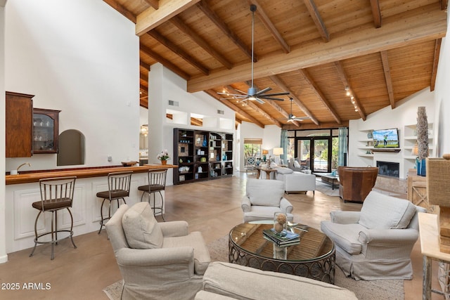5540 E Mercer Ln, Scottsdale, AZ 85254 - living area with a wooden ceiling with exposed beams, high vaulted ceiling, ceiling fan, a fireplace, and bar