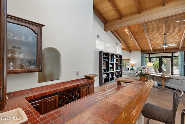 5540 E Mercer Ln, Scottsdale, AZ 85254 - bar area with a wood ceiling with exposed beams, a ceiling fan, and high vaulted ceiling
