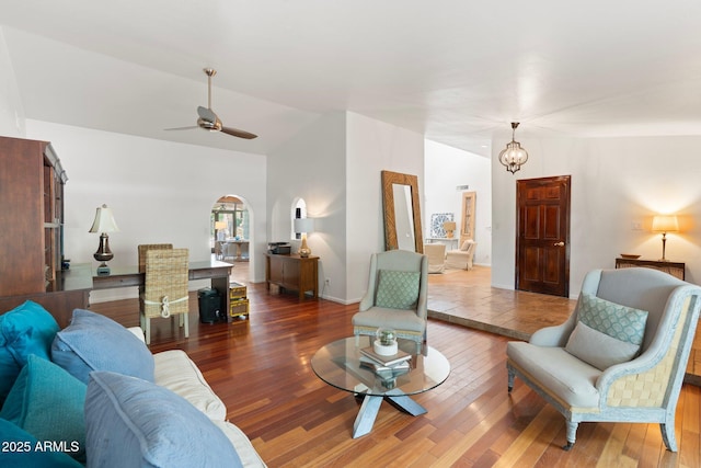 5540 E Mercer Ln, Scottsdale, AZ 85254 - living area with wood finished floors, arched walkways, ceiling fan, high vaulted ceiling, and a chandelier