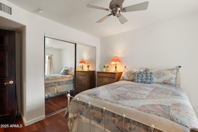 5540 E Mercer Ln, Scottsdale, AZ 85254 - bedroom with hardwood / wood-style flooring, a closet, and a ceiling fan