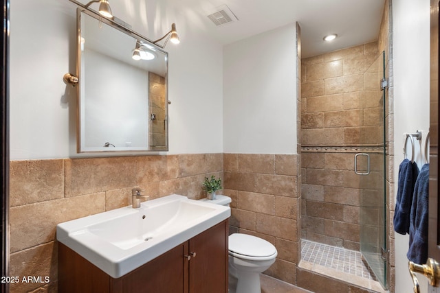 5540 E Mercer Ln, Scottsdale, AZ 85254 - full bath with tile walls, a shower stall, vanity, and a wainscoted wall