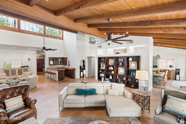 5540 E Mercer Ln, Scottsdale, AZ 85254 - living room with ceiling fan, a wooden ceiling with exposed beams, high vaulted ceiling, and arched walkways