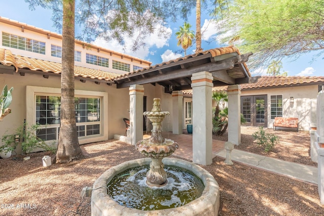 5540 E Mercer Ln, Scottsdale, AZ 85254 - back of property with stucco siding, french doors, a tile roof, and a patio area