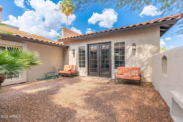 5540 E Mercer Ln, Scottsdale, AZ 85254 - back of property with french doors, stucco siding, a tile roof, and a patio