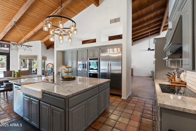 5540 E Mercer Ln, Scottsdale, AZ 85254 - kitchen featuring built in appliances, gray cabinets, a wooden ceiling with exposed beams, high vaulted ceiling, and decorative backsplash