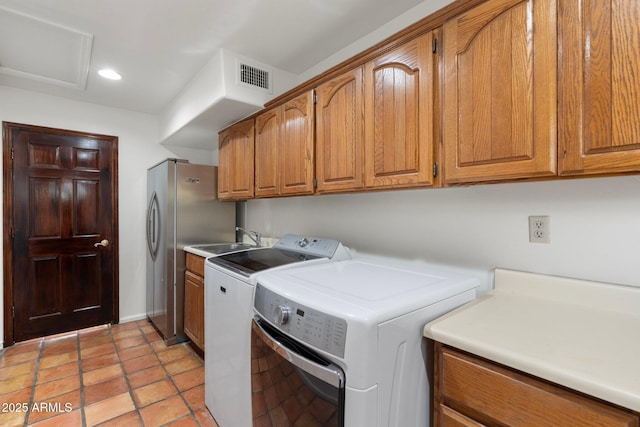 5540 E Mercer Ln, Scottsdale, AZ 85254 - laundry room with cabinet space, washing machine and clothes dryer, and recessed lighting