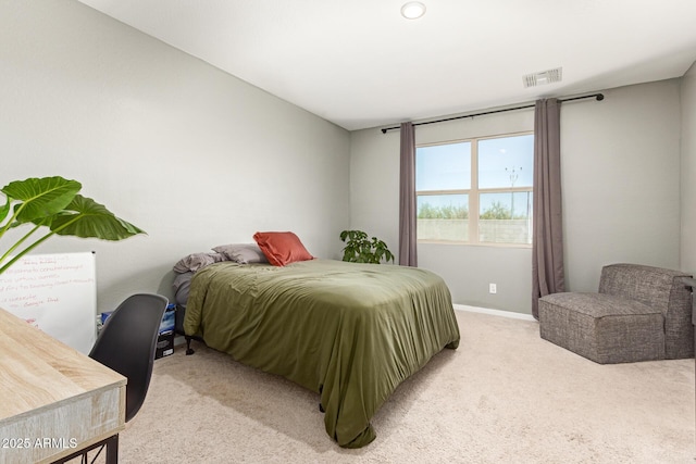 17344 W Red Fox Rd, Surprise, AZ 85387 - bedroom featuring visible vents, baseboards, and light carpet