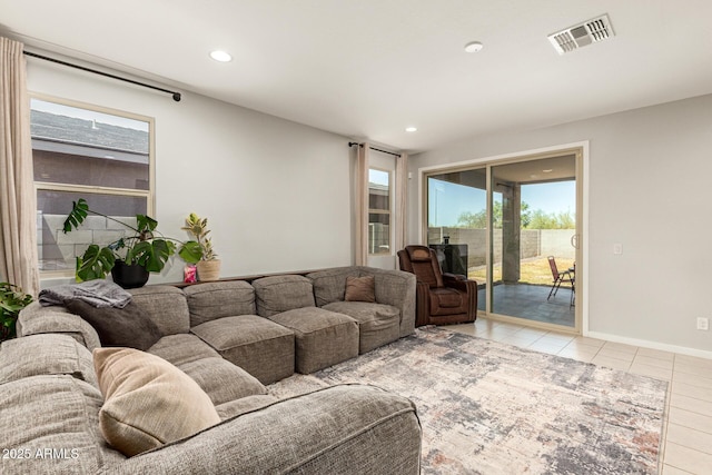 17344 W Red Fox Rd, Surprise, AZ 85387 - living area featuring light tile patterned floors, baseboards, recessed lighting, and visible vents