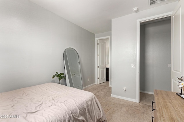 17344 W Red Fox Rd, Surprise, AZ 85387 - bedroom with baseboards, visible vents, and light colored carpet