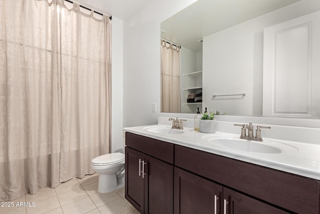 17344 W Red Fox Rd, Surprise, AZ 85387 - full bath with double vanity, a sink, tile patterned floors, and toilet