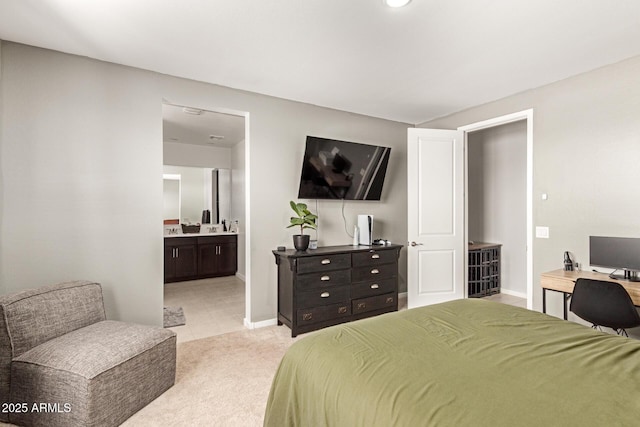 17344 W Red Fox Rd, Surprise, AZ 85387 - bedroom featuring light tile patterned floors, baseboards, connected bathroom, and light colored carpet