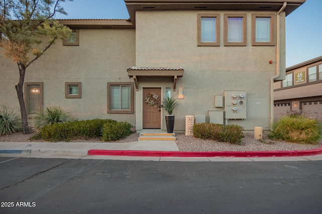 townhome / multi-family property featuring stucco siding