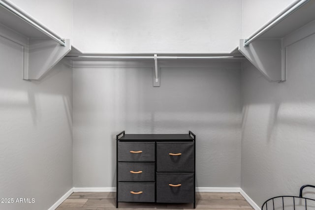 spacious closet with wood finished floors