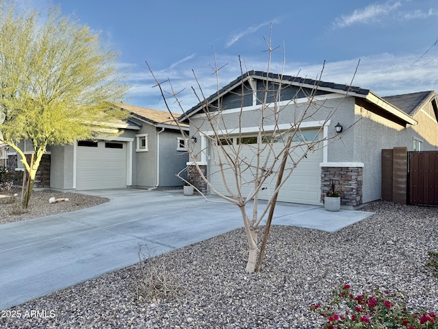 view of property exterior featuring concrete driveway, an attached garage, and stucco siding