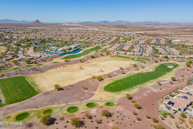 aerial view featuring view of golf course and a mountain view