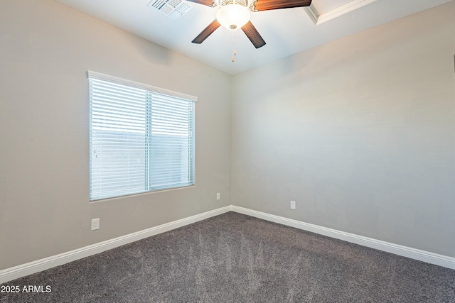 unfurnished room with a ceiling fan, carpet, visible vents, and baseboards