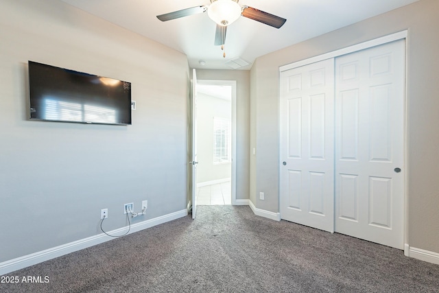 unfurnished bedroom with carpet, a closet, visible vents, ceiling fan, and baseboards