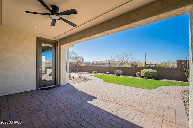 view of patio / terrace featuring ceiling fan and a fenced backyard