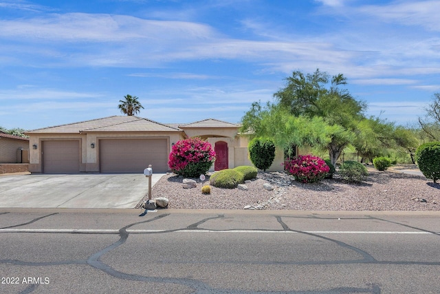 view of front of home with a garage