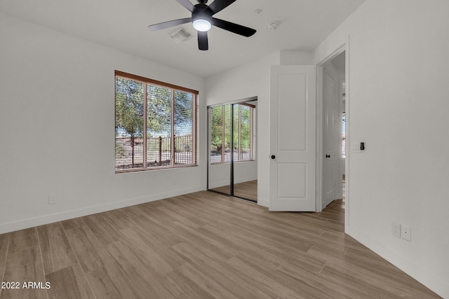 unfurnished bedroom featuring ceiling fan and light hardwood / wood-style flooring