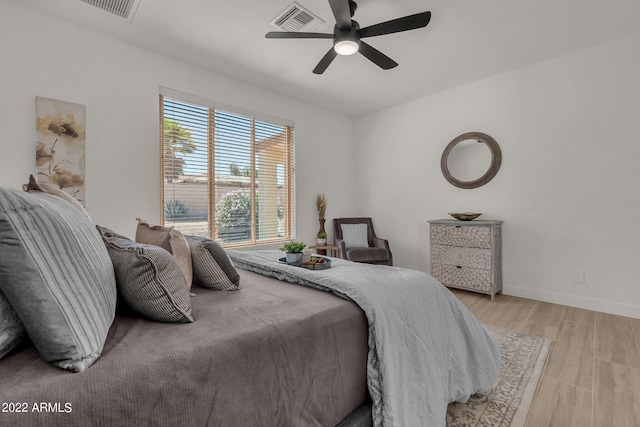 bedroom featuring ceiling fan and light hardwood / wood-style floors