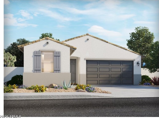 mediterranean / spanish-style house with a tile roof, a garage, driveway, and stucco siding