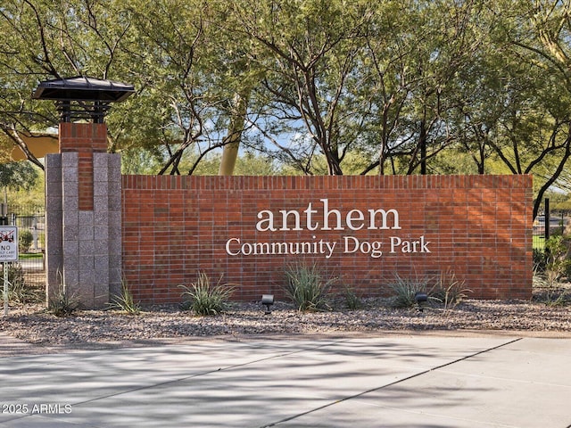 community sign with fence