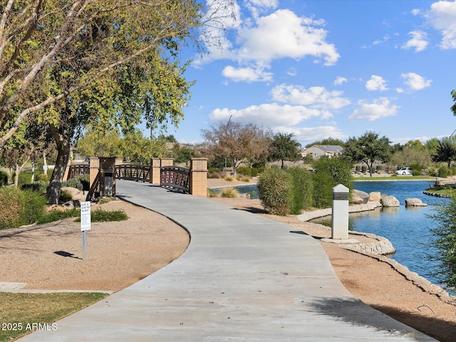 view of property's community featuring a water view and a gate