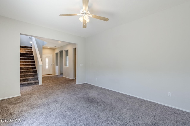 14881 W Ashland Ave, Goodyear, AZ 85395 - unfurnished room with carpet flooring, ceiling fan, stairs, and baseboards